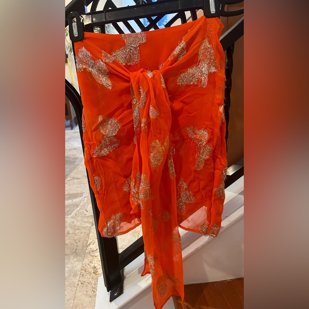 Happy orange with gold sparkles sexy  mini skirt with tie around front.
